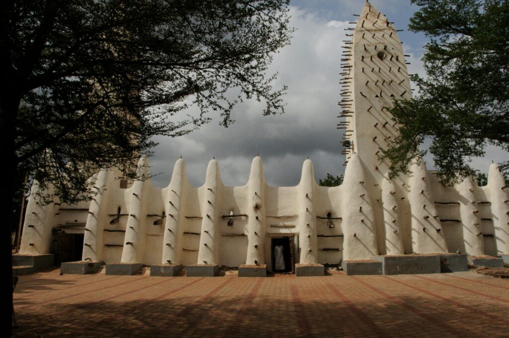 Stunning view of the Grand Mosque in Bobo-Dioulasso, Burkina Faso with dramatic sky.